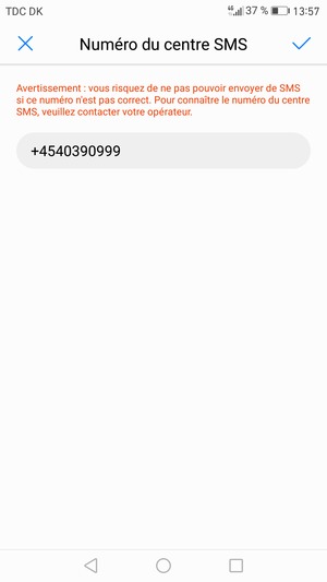 Saisissez le Numéro du centre SMS et sélectionnez OK