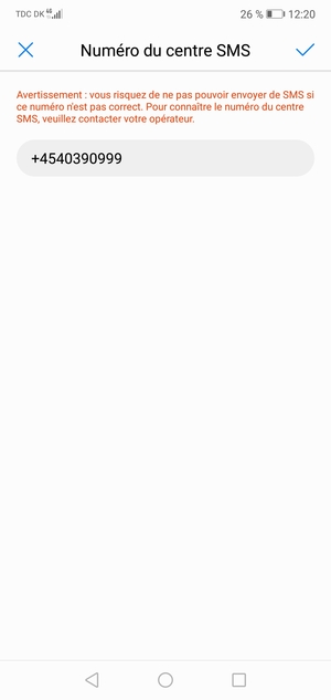 Saisissez le Numéro du centre SMS et sélectionnez OK