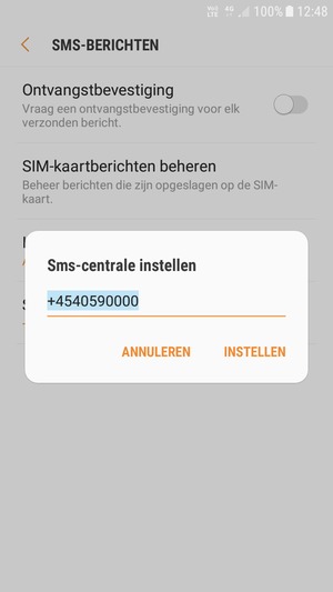 Voer het Sms-centrale nummer in en selecteer INSTELLEN