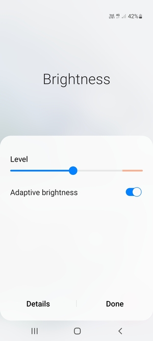 Turn on Adaptive brightness and select Done