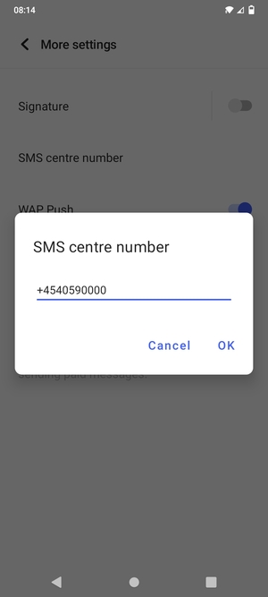 Enter the SMS centre number and select OK