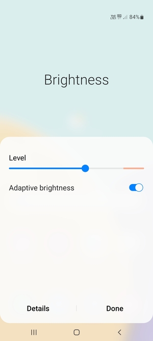 Turn on Adaptive brightness and select Done
