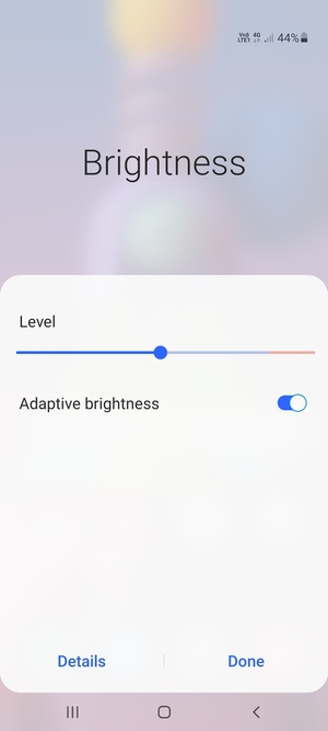 Turn on Adaptive brightness and select Done