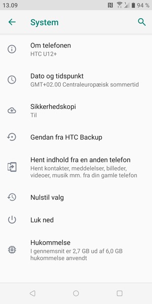 Vælg Om telefonen