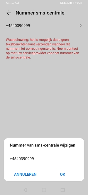Voer het Nummer sms-centrale in en selecteer OK