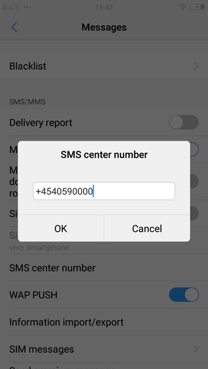 Enter the SMS center number and select OK